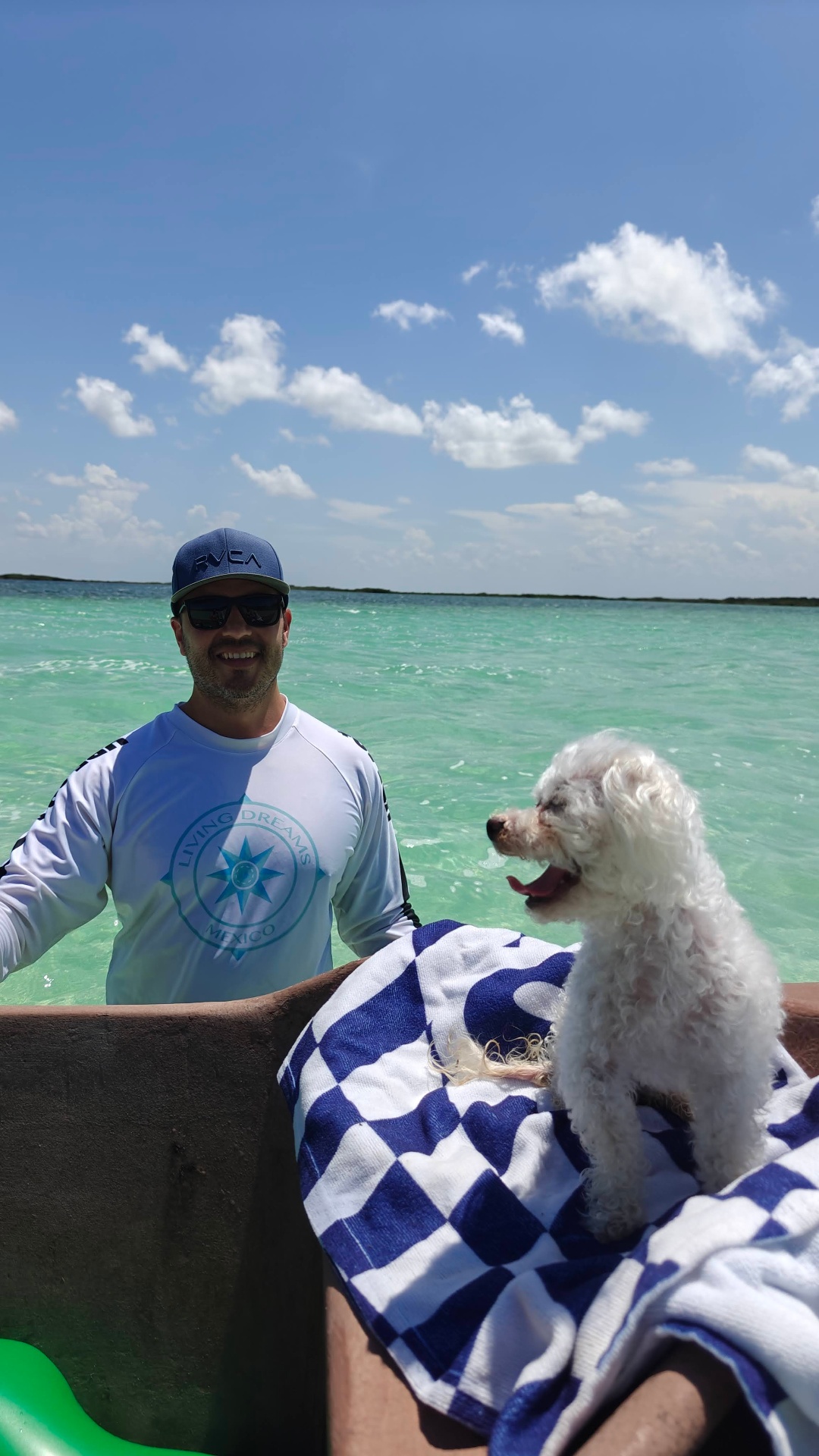 Joaquin of Living Dreams Mexico with Biggie Smalls at Bacalar Lagoon — the partnership behind The Conscious Creator advisor immersion program