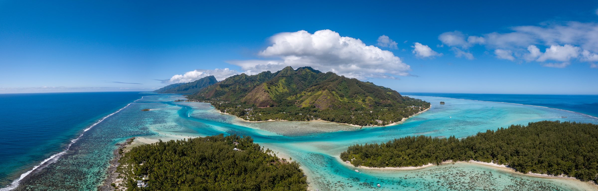 Aerial view of Moorea and Tahiti islands and their lagoon in French Polynesia, about 25 to 45 minutes apart by ferry
